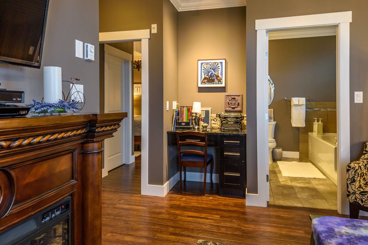 the "midnight in paris" suite | living room | flat-screen tv, fireplace