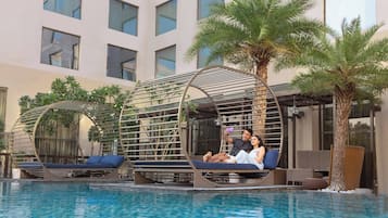 Outdoor pool, pool umbrellas, sun loungers