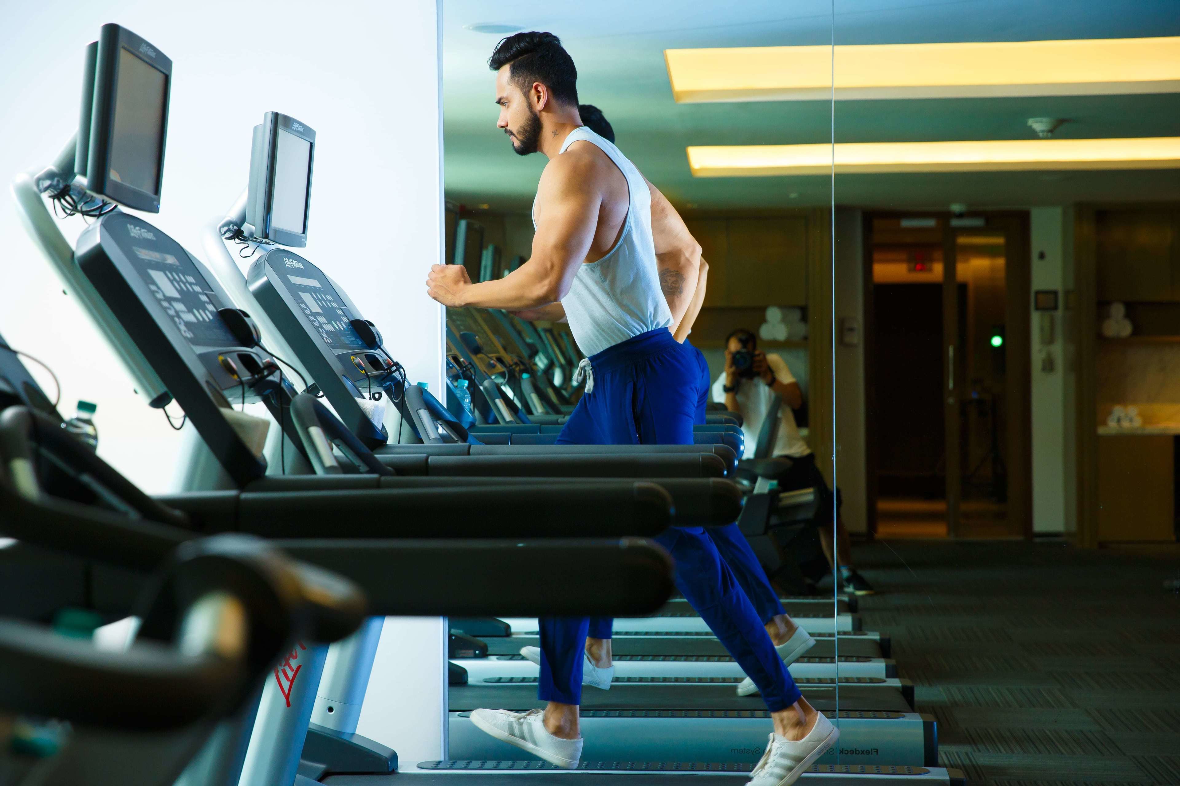 A gym with treadmills and exercise equipment.