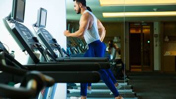 A gym with treadmills and exercise equipment.