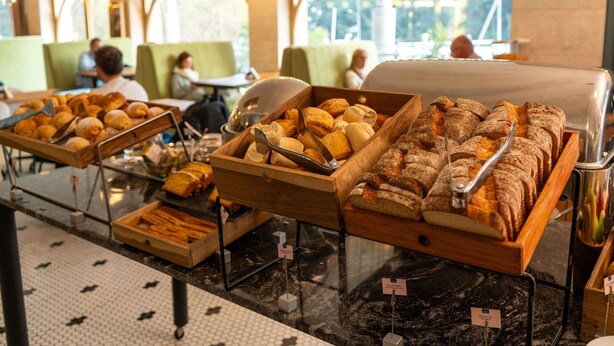 A buffet with various baked goods and pastries. - Ibis Pilar (Villa Rosa)