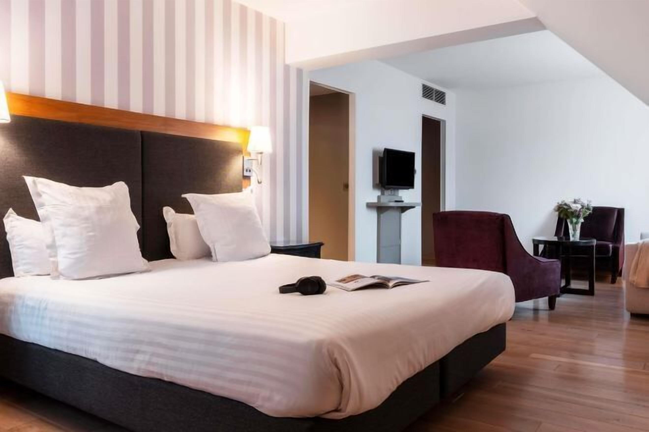 Premium bedding, memory foam beds, in-room safe, desk