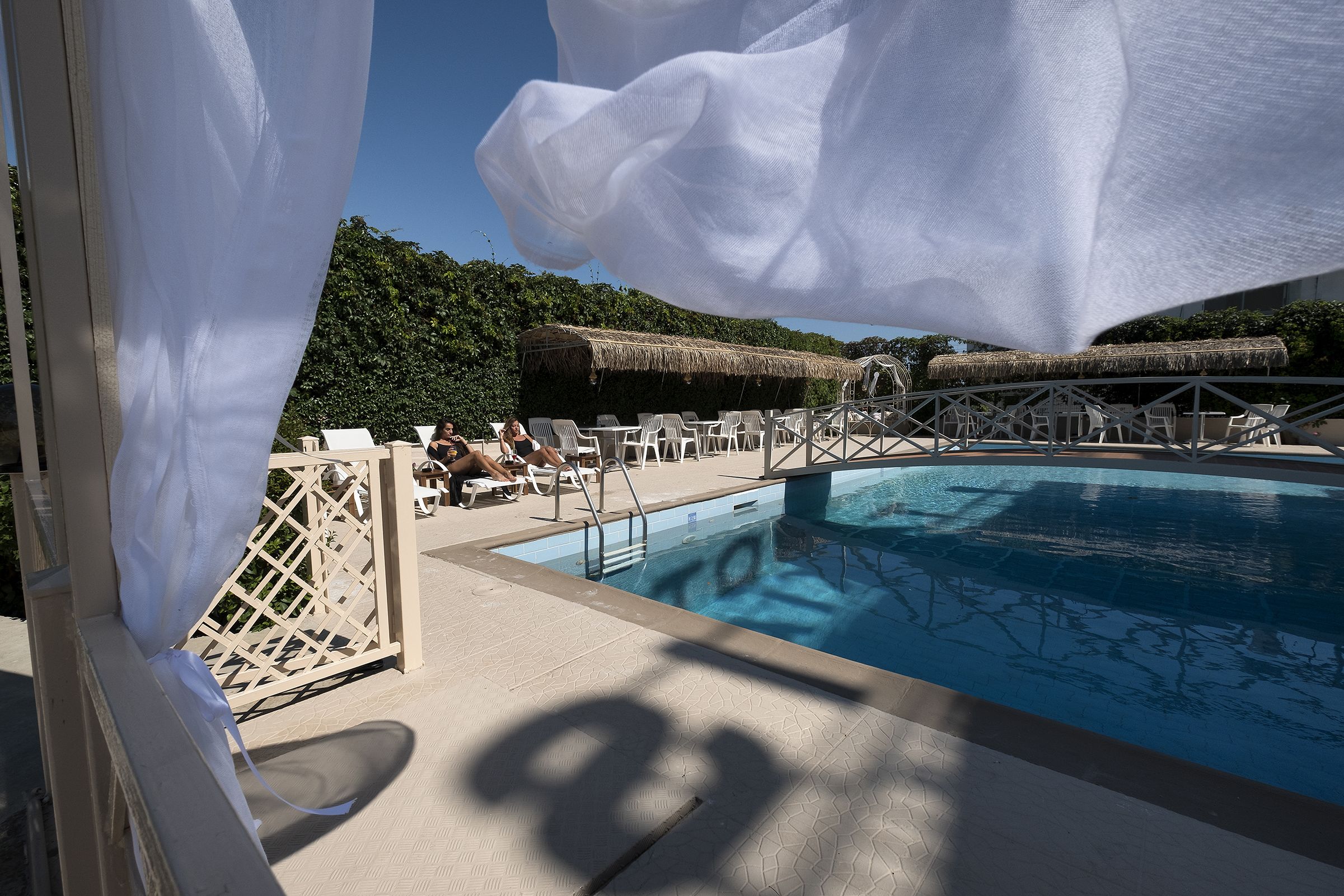 seasonal outdoor pool, pool umbrellas, pool loungers