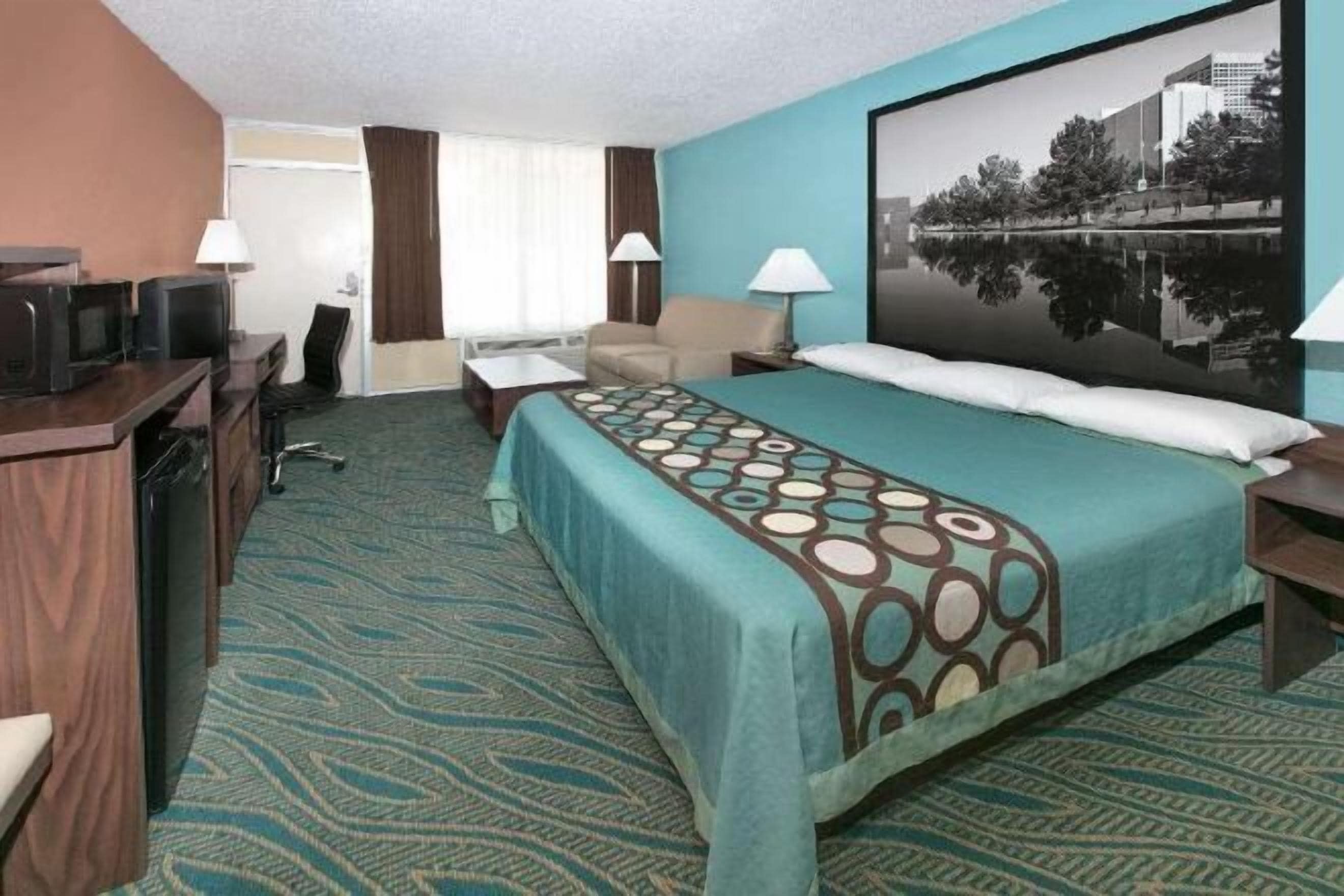 Desk, laptop workspace, blackout drapes, free cribs/infant beds