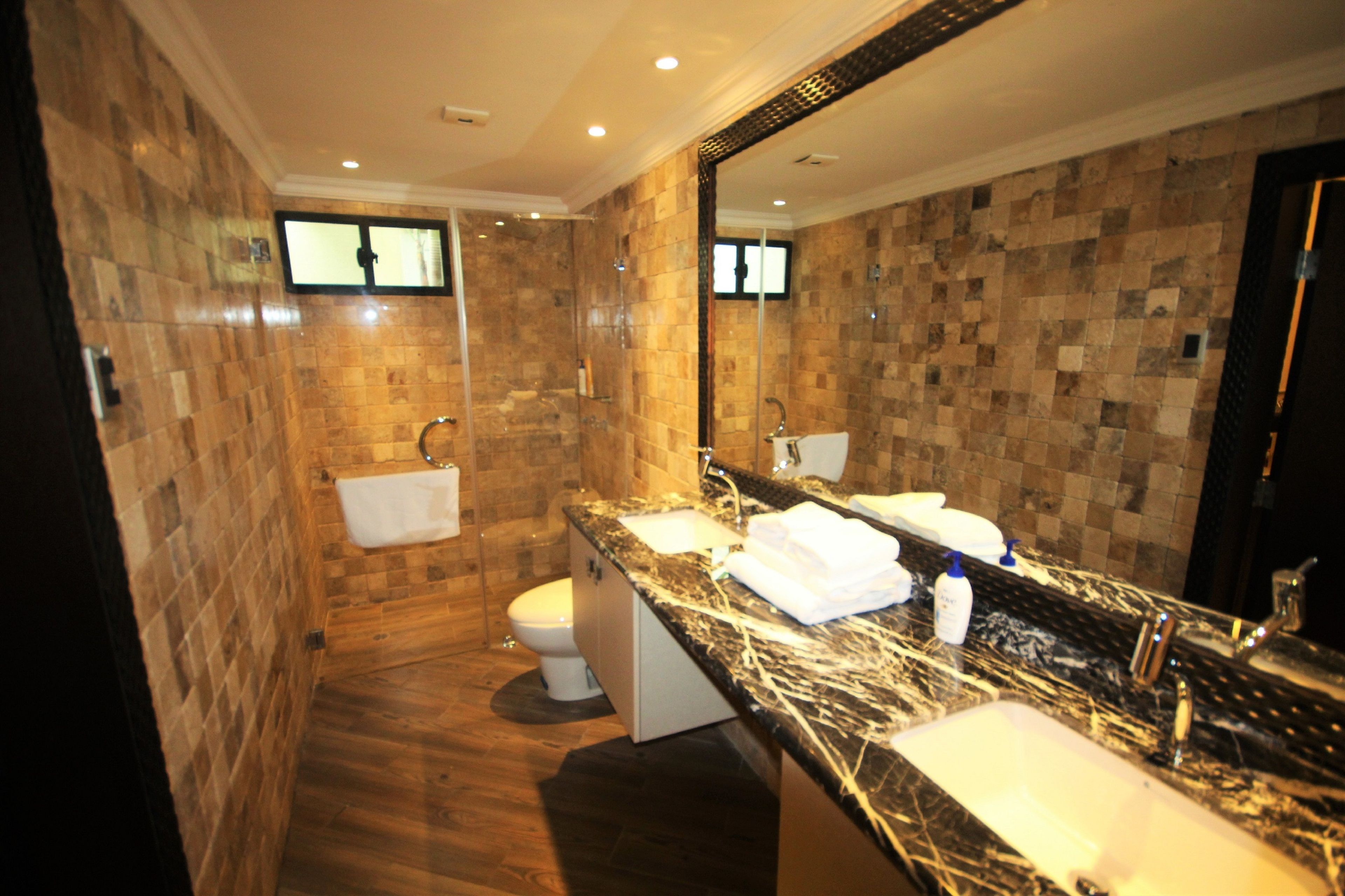 exclusive apartment | bathroom | hair dryer, towels, soap, shampoo