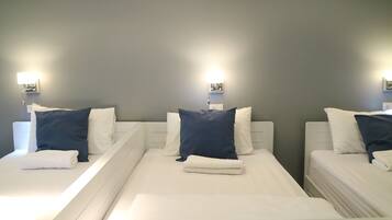 Family 4 beds Room | Premium bedding, in-room safe, individually decorated, desk