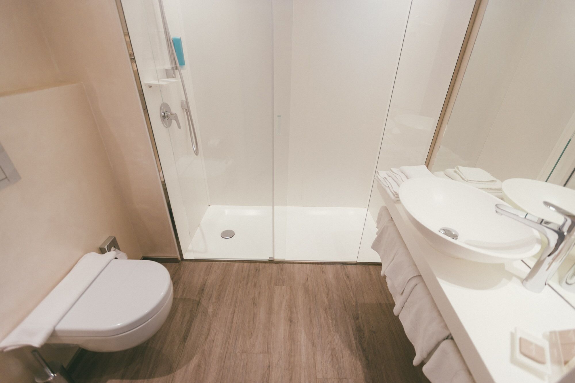 shower, free toiletries, slippers, towels