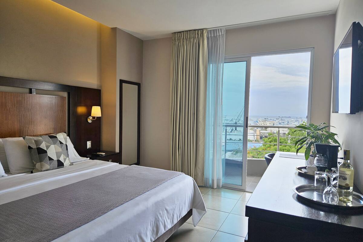 king room balcony and harbour view | premium bedding, minibar, in-room safe, soundproofing