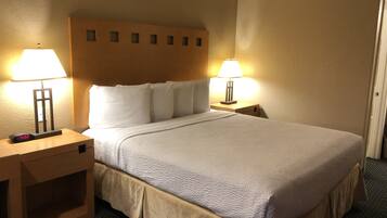 Standard Room | Desk, laptop workspace, blackout drapes, iron/ironing board