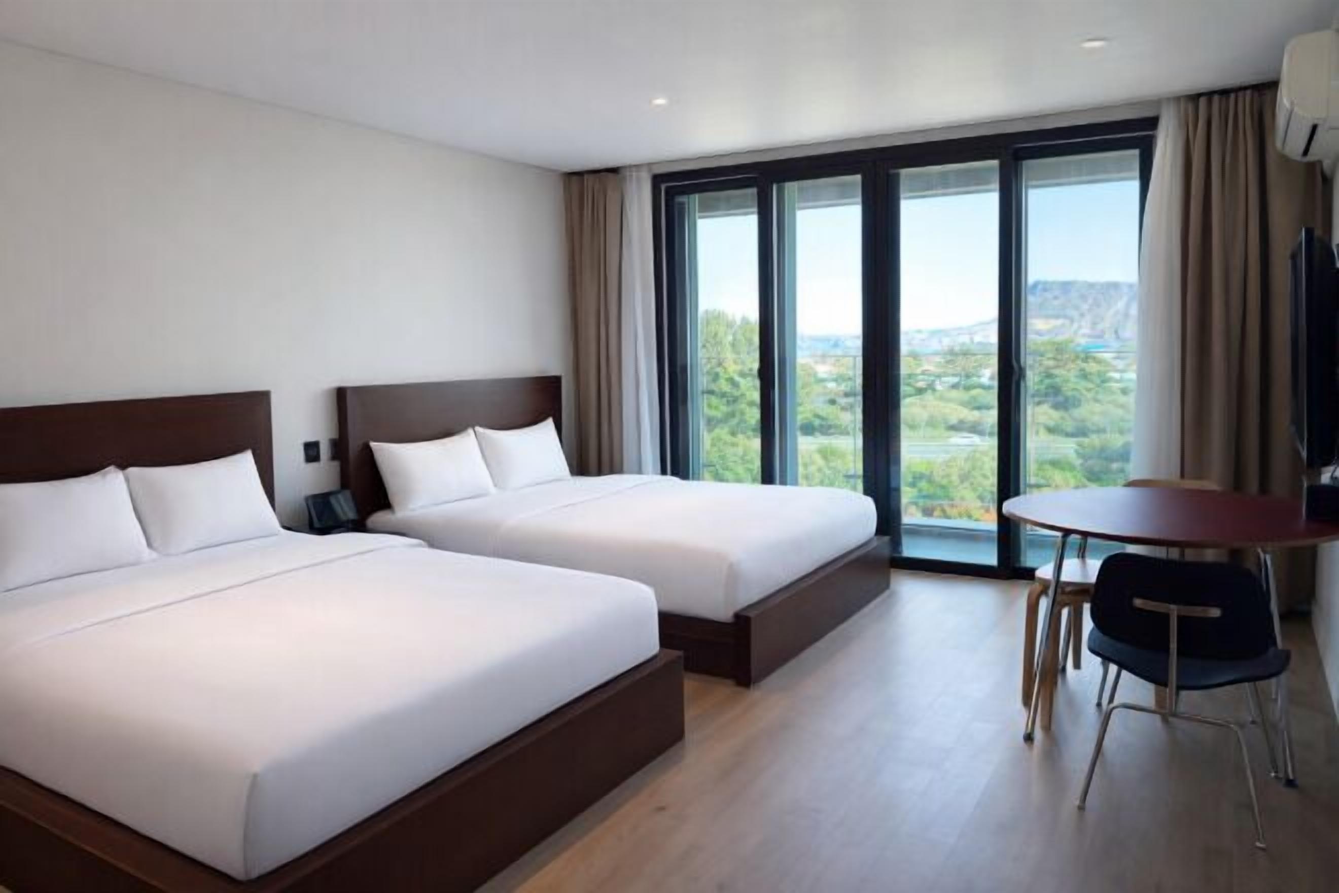 Premium bedding, blackout drapes, free WiFi, bed sheets