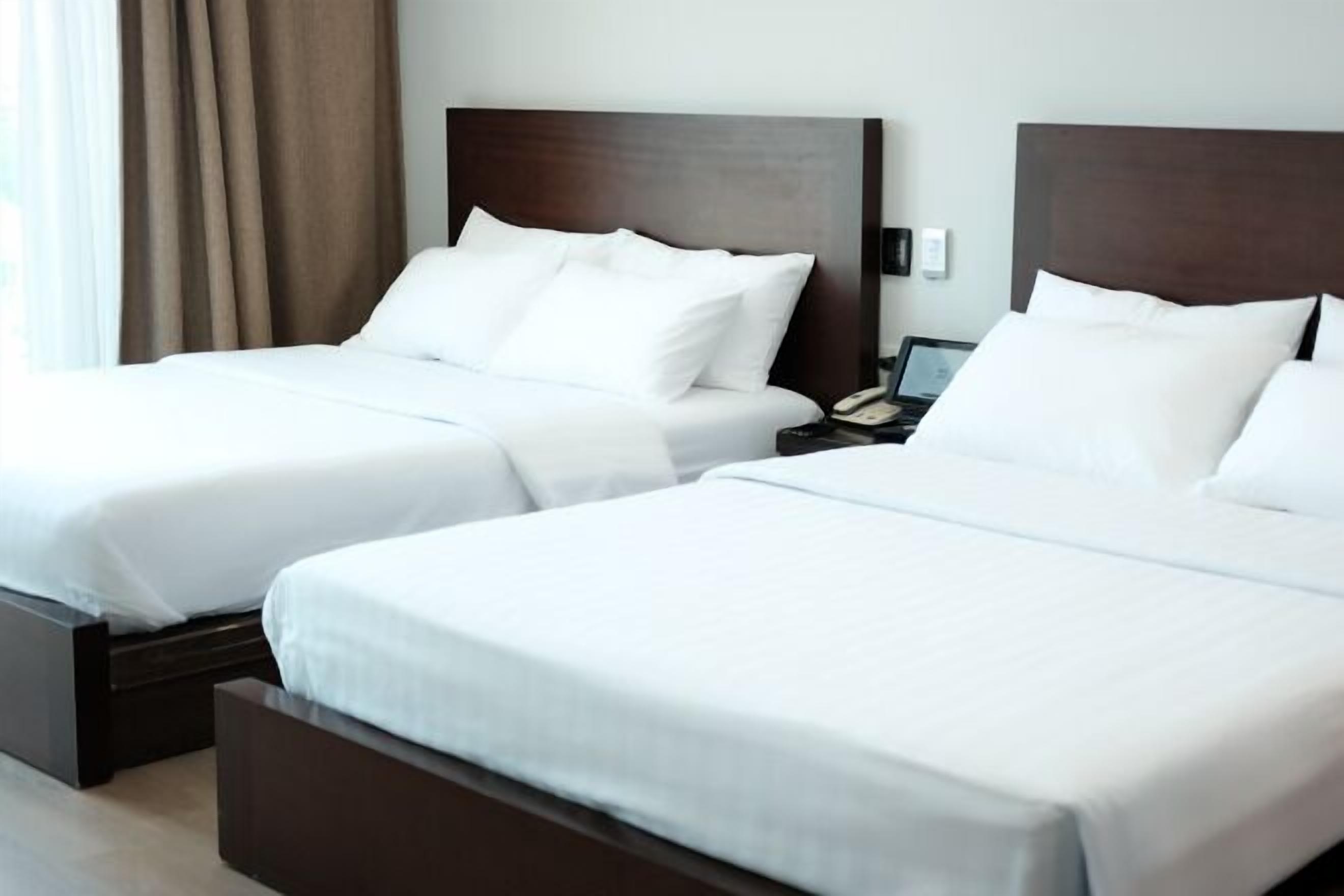 Premium bedding, blackout drapes, free WiFi, bed sheets