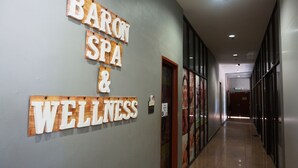 A hallway with a sign reading "BARON SPA & WELLNESS". - Langgura Baron Resort (Langkawi)