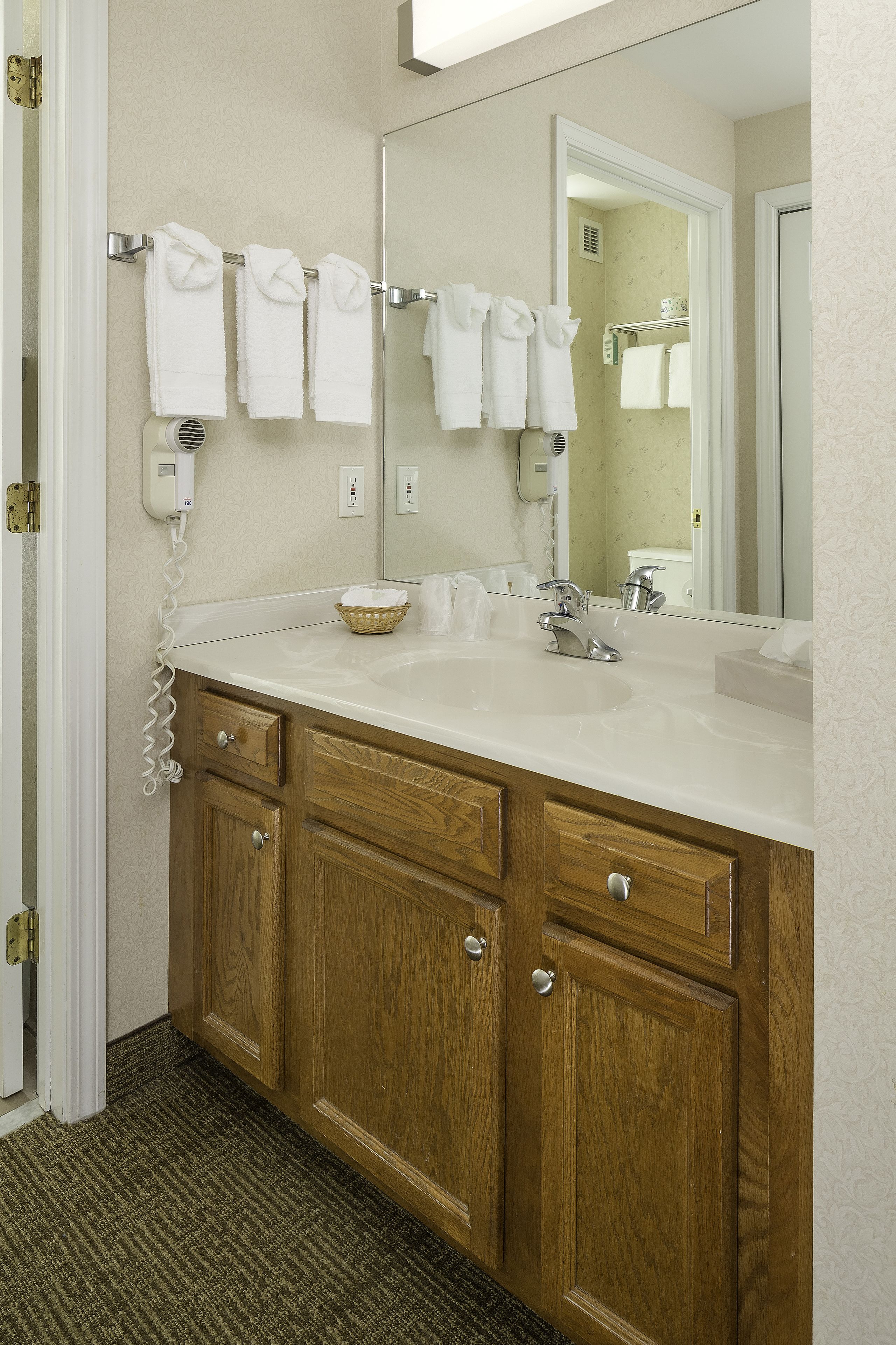 one bedroom suite, 1 king bed | bathroom | free toiletries, hair dryer, towels