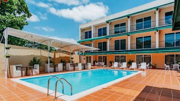 Outdoor pool, open 10:00 AM to 9:00 PM, pool loungers