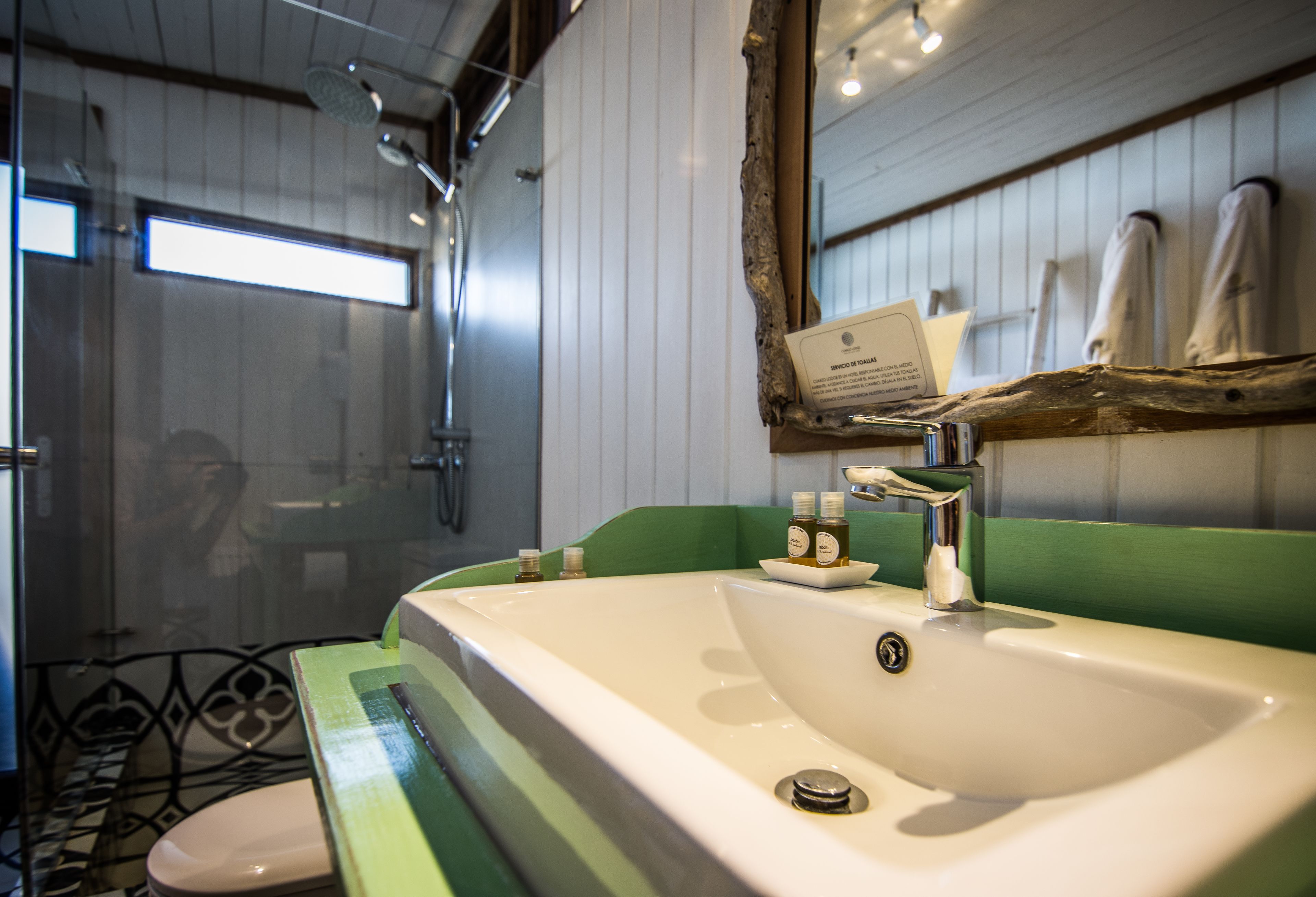 deluxe suite | bathroom | shower, hair dryer, bathrobes, towels