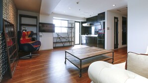 Deluxe Two Bedroom Apartment | Living area | Flat-screen TV - 1/3rd Residence Serviced Apartments Shibuya-Yoyogi (Tokyo)