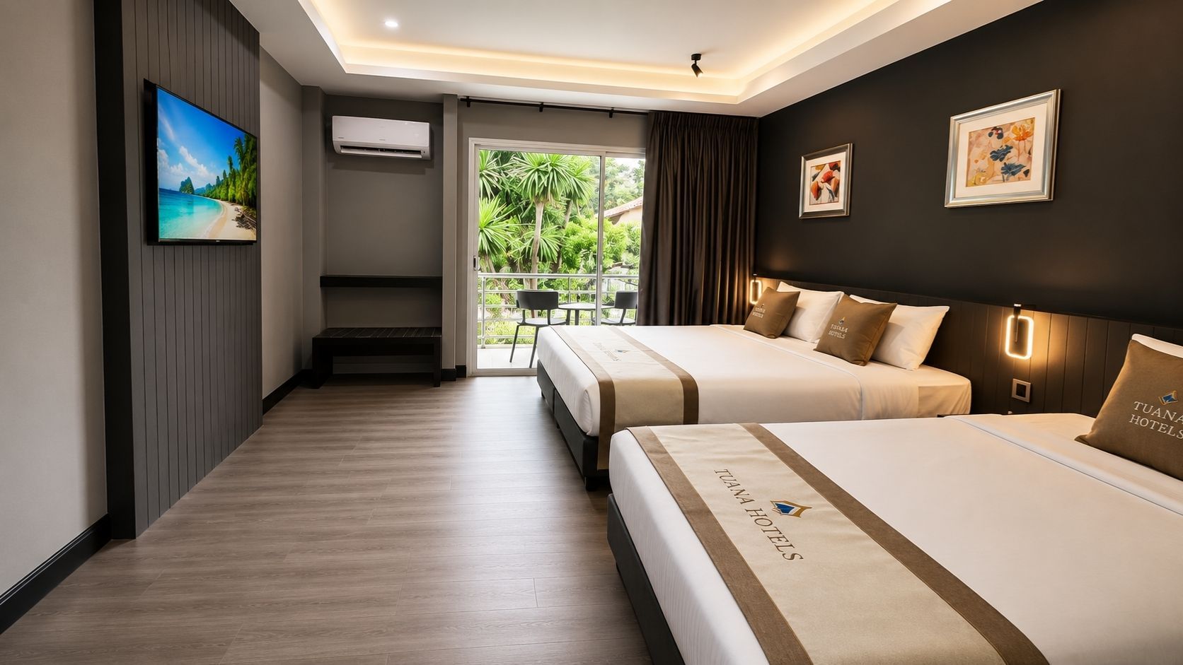 A hotel room with two beds, a TV, an air conditioner, and a balcony with a view of greenery.