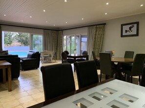 Deluxe Apartment, 4 Bedrooms, Kitchen, Pool View | Living area | 32-inch flat-screen TV with satellite channels, TV - Ilanda Guest House (Mbombela)