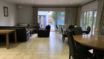 Deluxe Apartment, 4 Bedrooms, Kitchen, Pool View | Living area | 32-inch flat-screen TV with satellite channels, TV