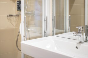 Shower, free toiletries, hair dryer, towels