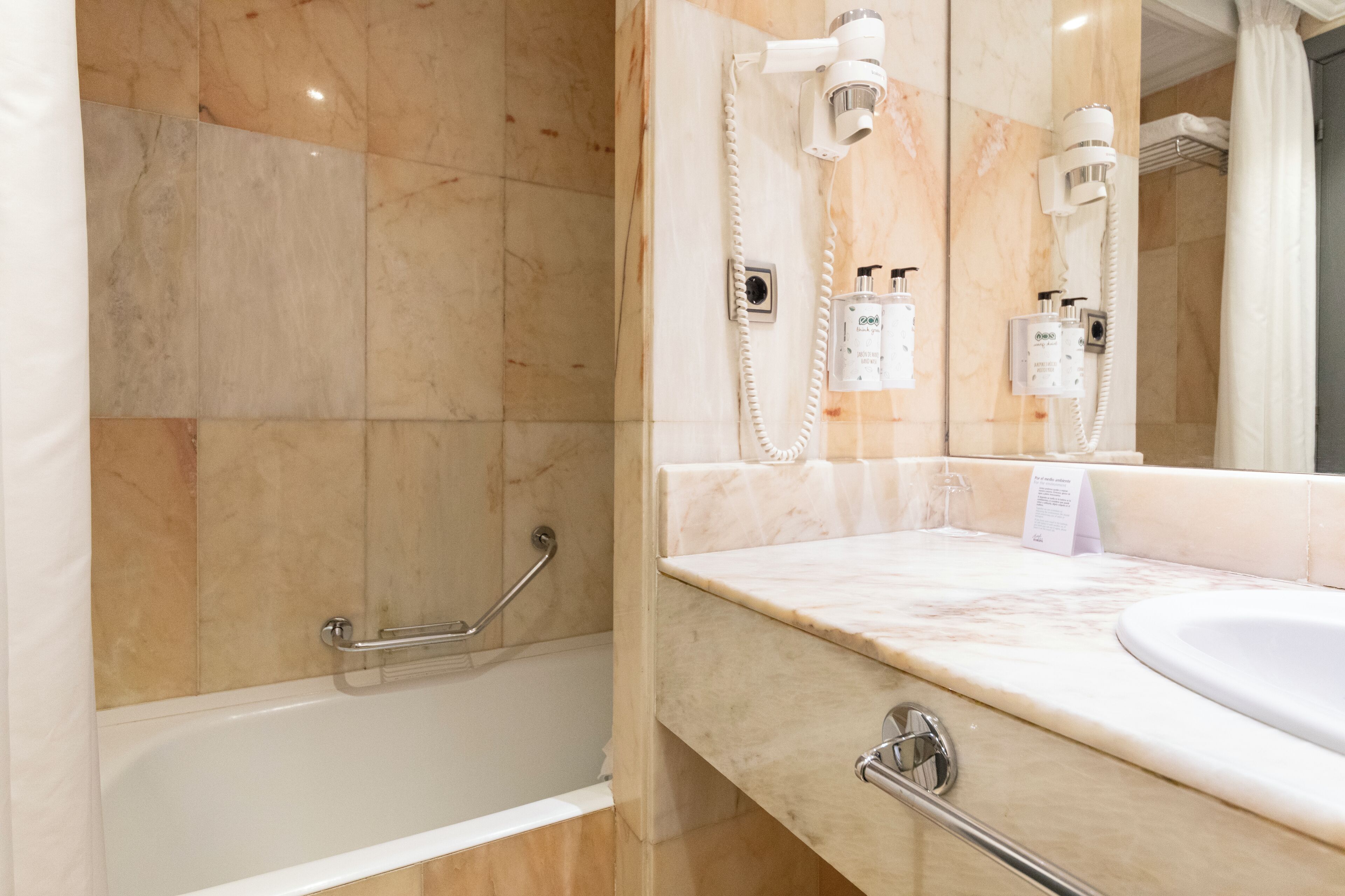 basic single room interior | bathroom | combined shower/bathtub, free toiletries, hair dryer, towels