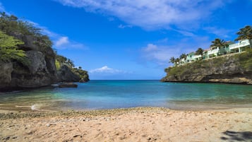 On the beach, white sand, sun loungers, scuba diving