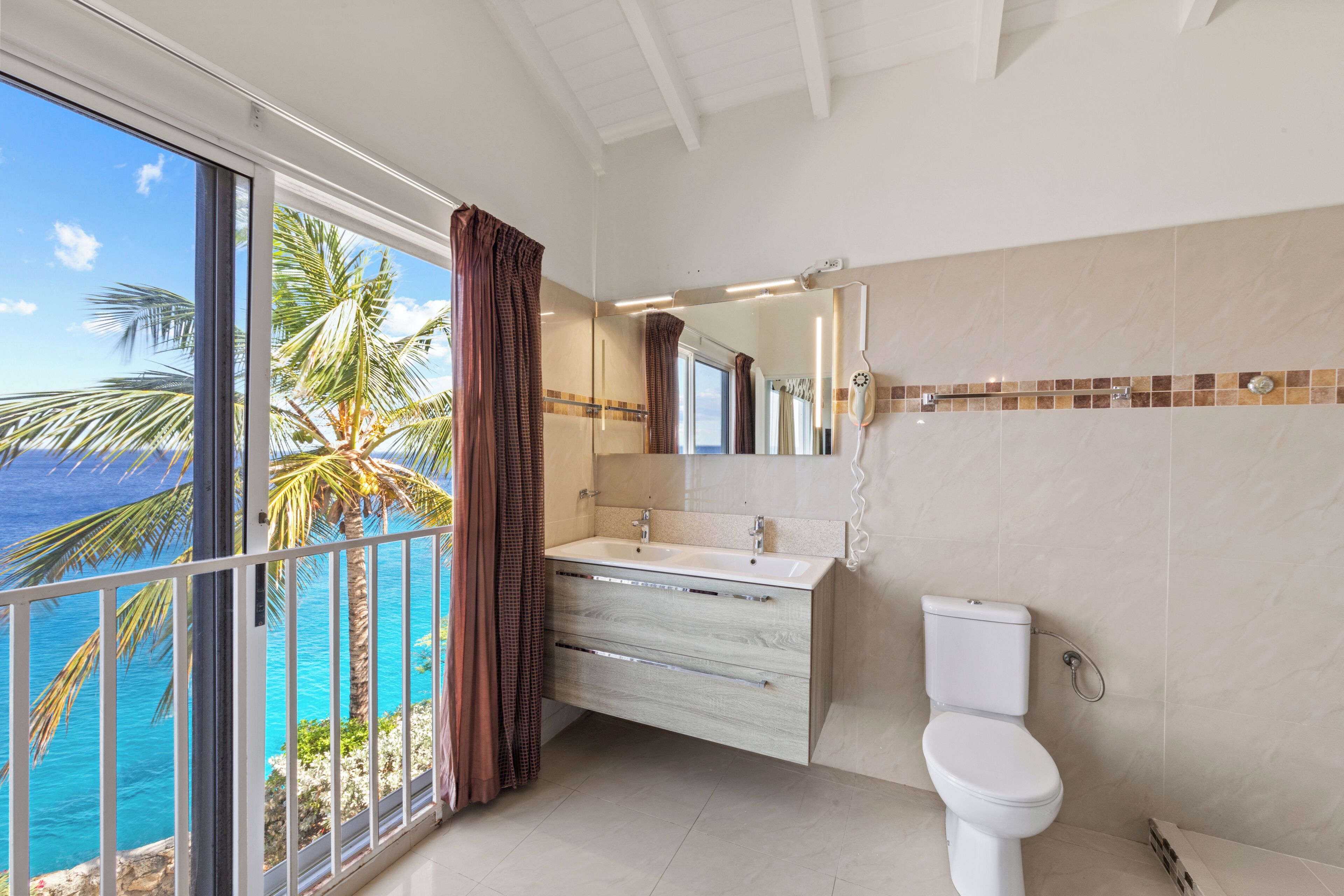 exclusive villa, 2 bedrooms, jetted tub, ocean view | bathroom | combined shower/bathtub, hair dryer, towels