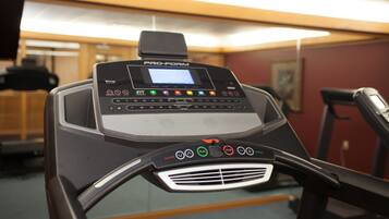 A ProForm treadmill with a digital display, control panel, and ventilation grille.