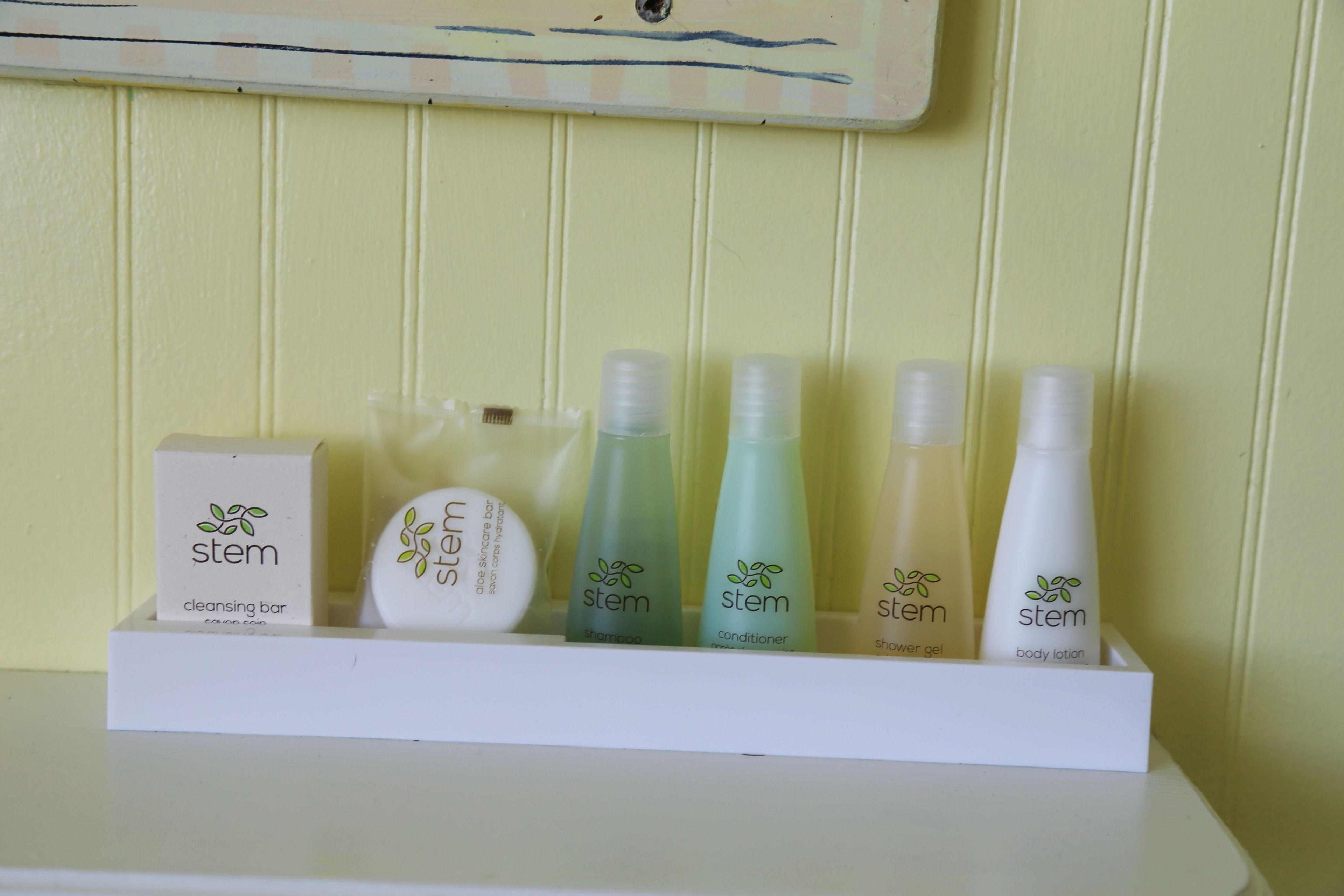 A shelf with various skincare products from the brand 'stem'.