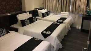 A hotel room with two beds, each with white linens and black headboards, a desk with a mirror, and a shower area. - Seasons Hotel - Causeway Bay (Hong Kong)