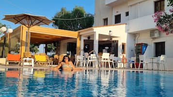 Outdoor pool, pool umbrellas, sun loungers