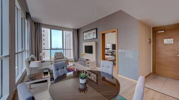 Suite, Sea View | Minibar, in-room safe, desk, iron/ironing board
