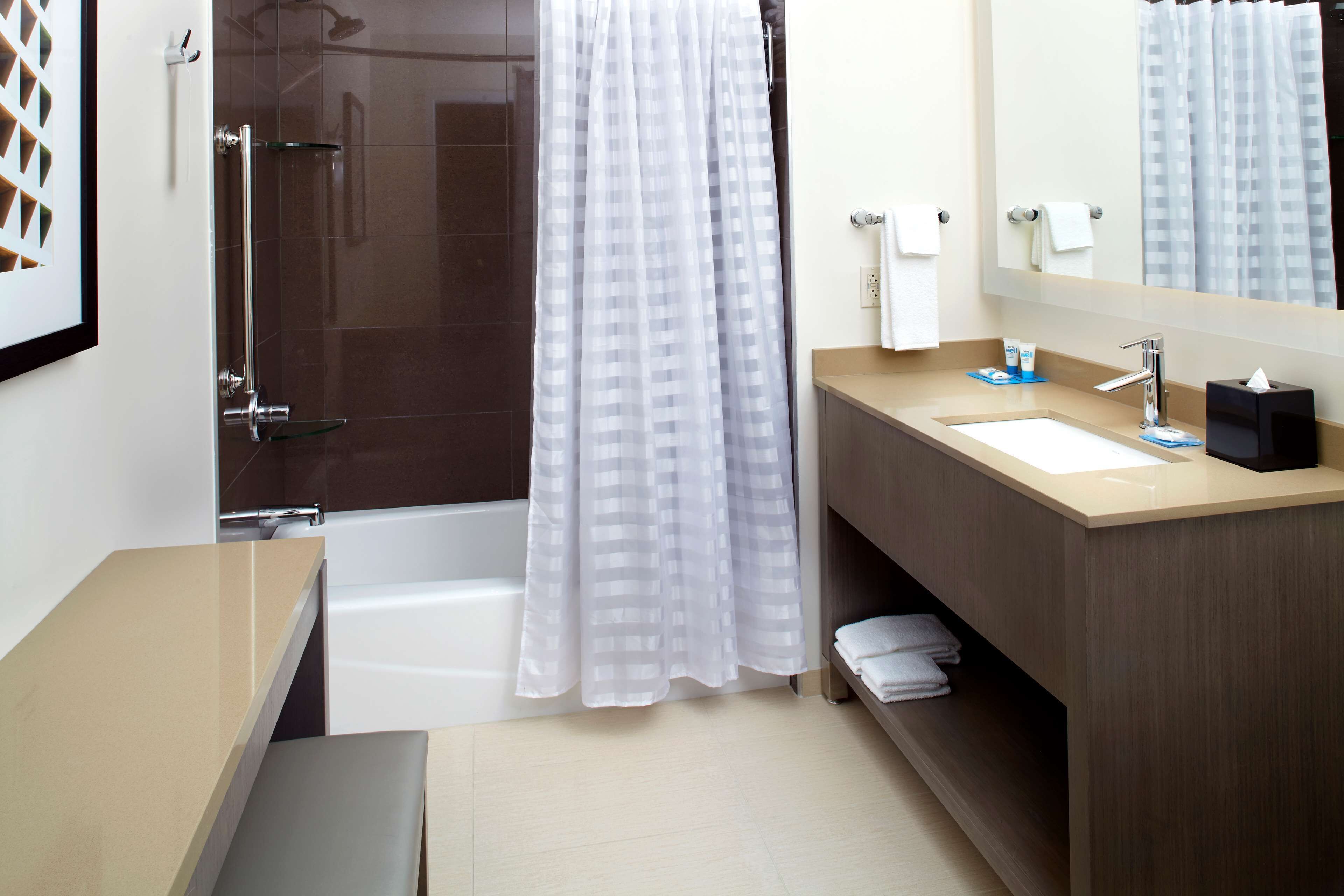 suite, 2 queen beds | bathroom | free toiletries, hair dryer, towels