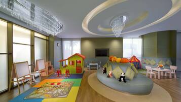 Children can play and relax in this spacious room with a playhouse, play mat, and flat-screen TV.