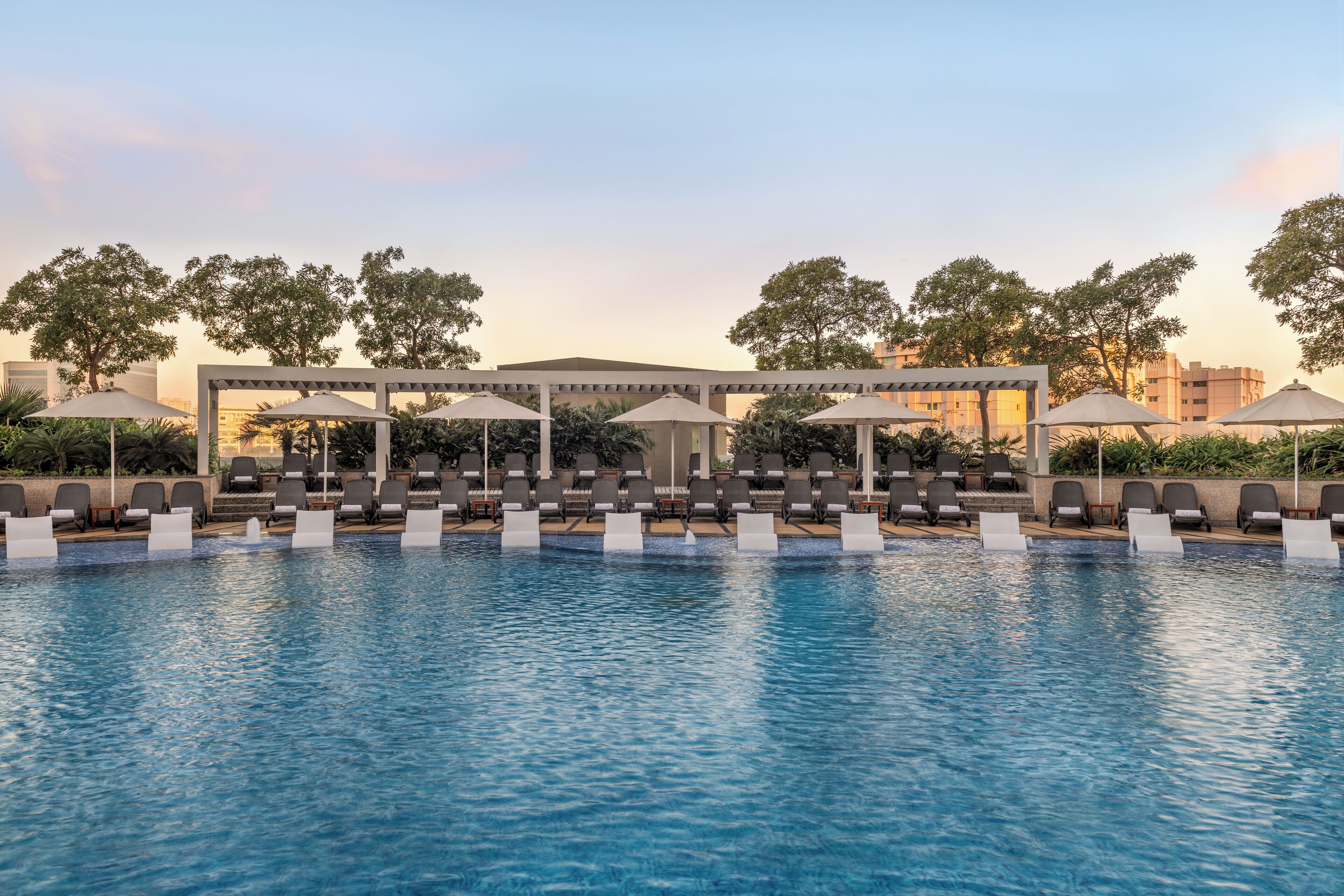 2 outdoor pools, open 6:30 am to 10:00 pm, pool umbrellas, pool loungers