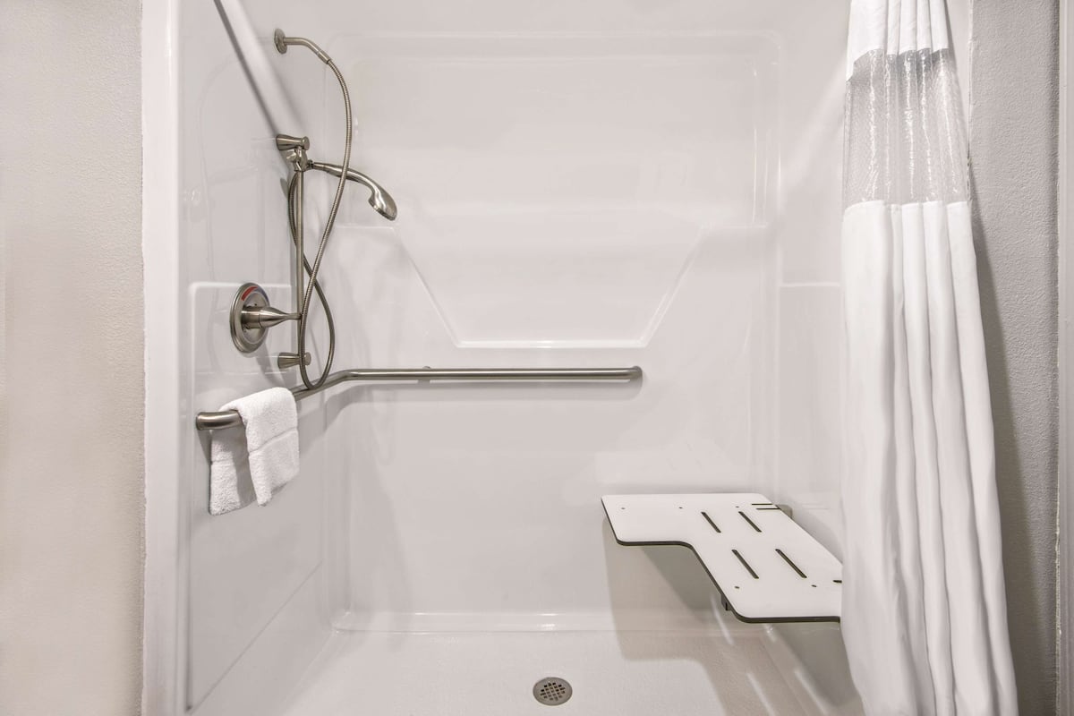 premium bedding, pillow-top beds, desk, laptop workspace