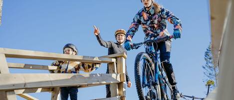 A wooden structure with a person on a bicycle.