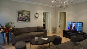 Apartment, 2 Bedrooms (with balcony) | Living area | 42-inch flat-screen TV with cable channels