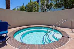 Outdoor pool, open 9:00 AM to 10:00 PM, pool loungers