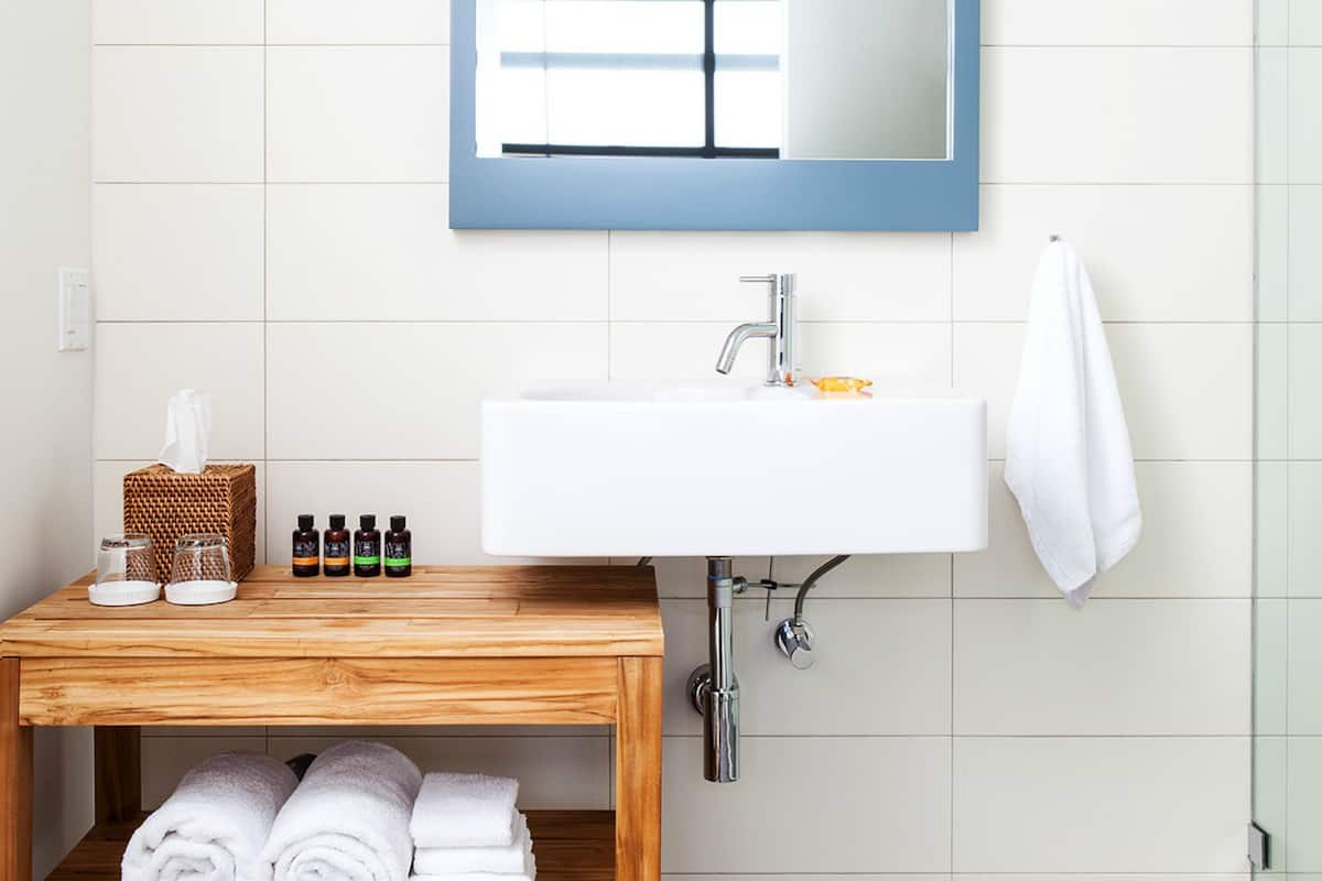 designer toiletries, hair dryer, towels