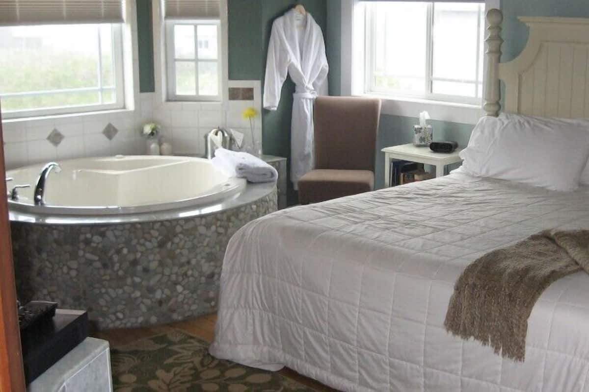 Deluxe Room, 1 King Bed, Jetted Tub, Canal View | 1 bedroom, premium bedding, iron/ironing board, free WiFi