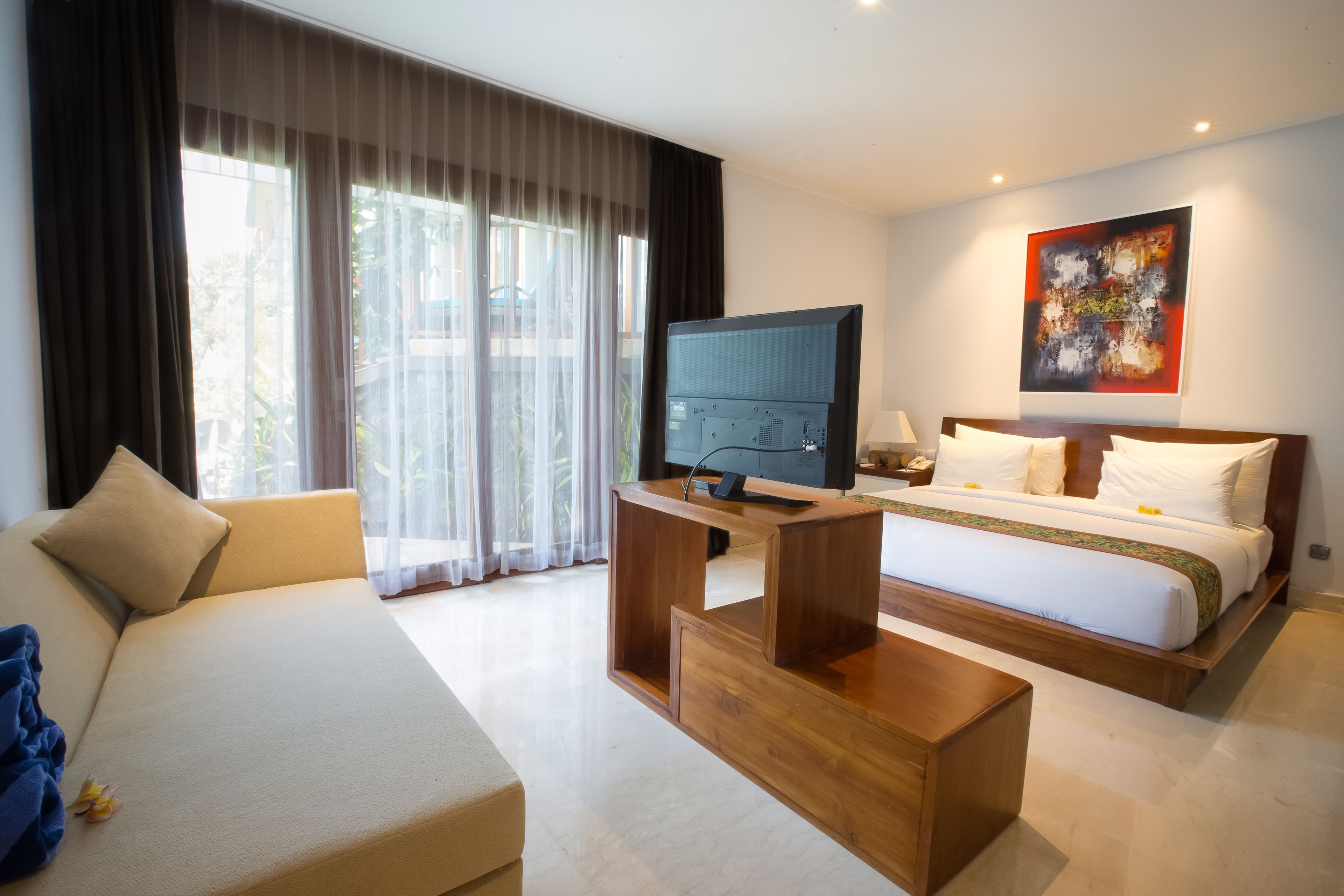 family room | minibar, in-room safe, desk, blackout curtains