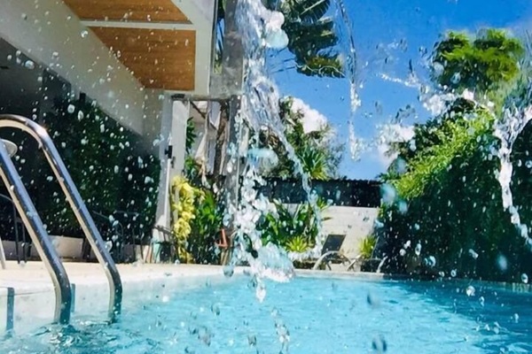 Outdoor pool, a waterfall pool, sun loungers