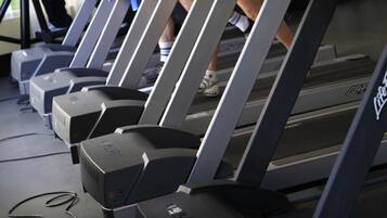 A gym with treadmills and exercise equipment.