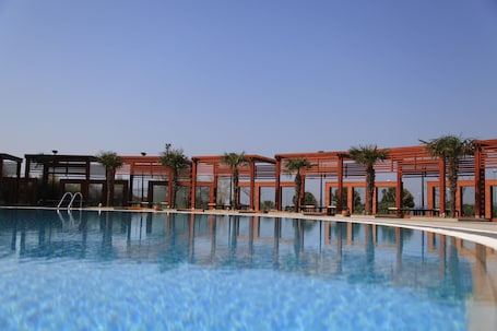 Indoor pool, seasonal outdoor pool, pool umbrellas, sun loungers