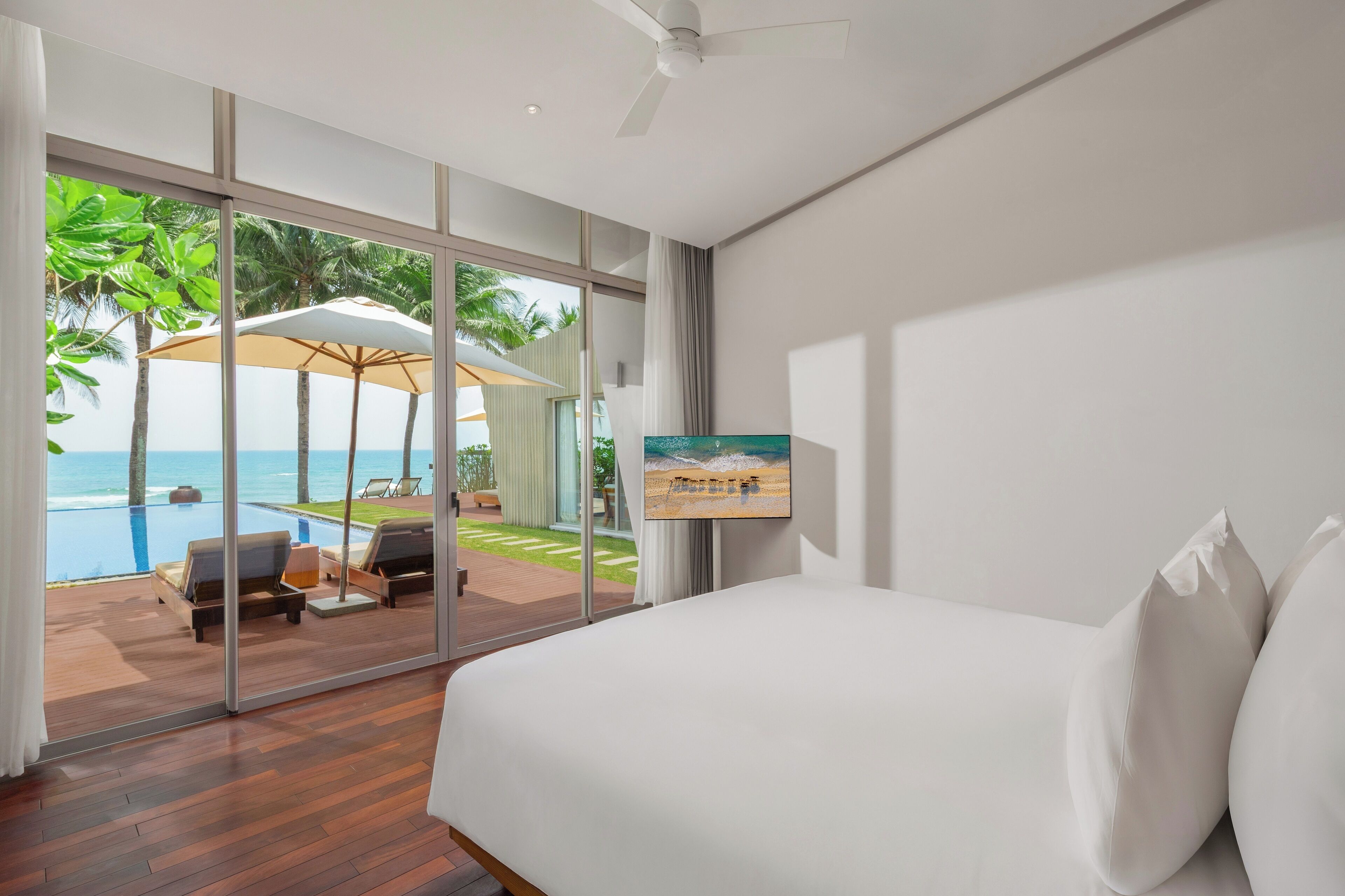 Beachfront Three-bedroom Wave Pool Villa (Spa Inclusive) | Minibar, in-room safe, desk, laptop workspace