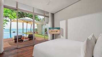 Beachfront Three-bedroom Wave Pool Villa (Spa Inclusive) | Minibar, in-room safe, desk, laptop workspace