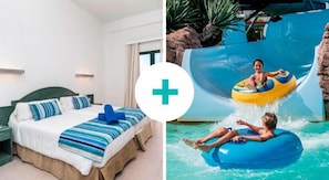 Una habitación de hotel con una cama, una mesita de noche y una ventana.