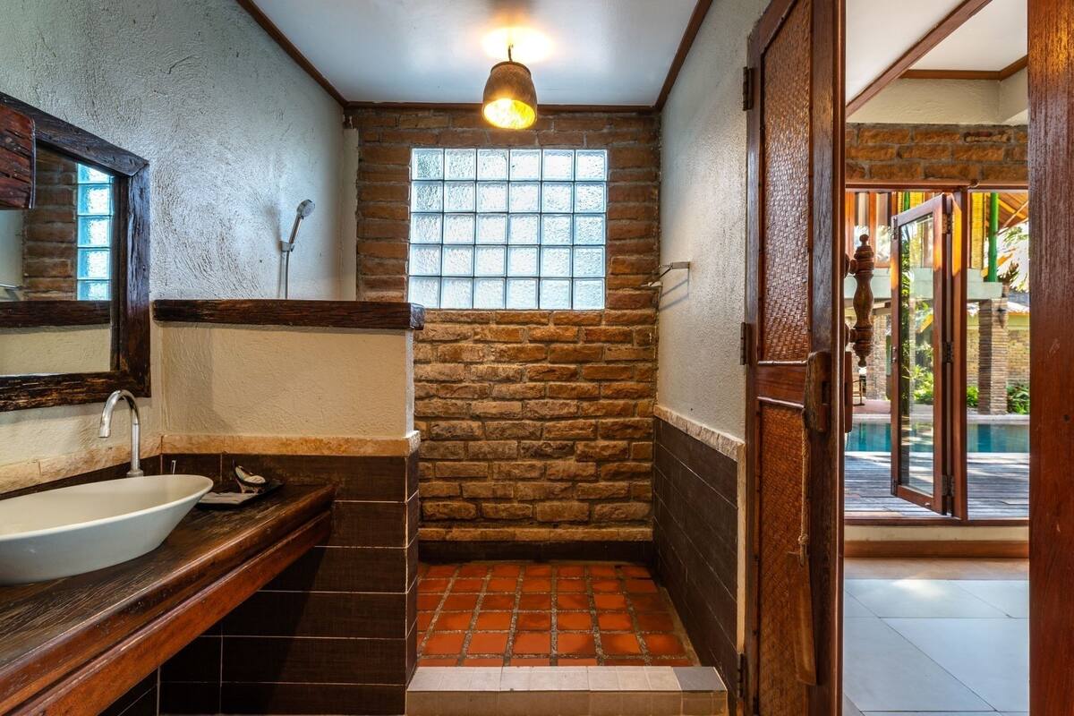 pool side villa sea view  | bathroom | shower, free toiletries, hair dryer, slippers