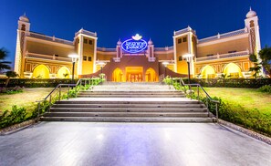 A grand entrance with a sign reading "Jasmine Palace Resort" leading to a set of stairs. - Jasmine Palace Resort & Spa (Hurghada)